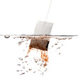 Green tea bag dipped in hot water