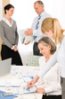 Foto: Sales meeting business people review reports Sales meeting business people review reports