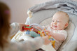 Adorable baby playing with older sister