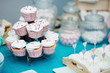 Delicious colorful wedding cupcakes with hearts icing