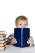 The boy reads the book isolated on white