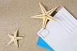 blank postcard on sand