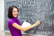 Smiling student near the blackboard Smiling student near the blackboard