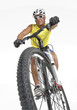 Photo: Joven deportista montando bicicleta montañera. Joven deportista montando bicicleta montañera.