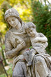 Monument of the woman with the child on a cemetery Monument of the woman with the child on a cemetery