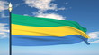 Flag Of Gabon on the background of the sky and flying clouds. Flag Of Gabon on the background of the sky and flying clouds.