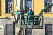 Photo: men pruning with a chainsaw men pruning with a chainsaw