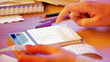 Close up of a hand with calculator