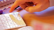 Close up of a hand with calculator