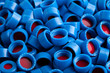 Photo: Blue and red plastic caps background Blue and red plastic caps background