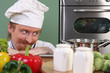 Young chef preparing lunch in kitchen