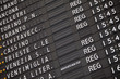 Electronic train timetable close-up on railway station in Italy