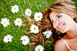 Woman lying on a flower garden