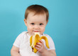 Baby eating a banana