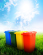 Colorful recycle bins with landscape background