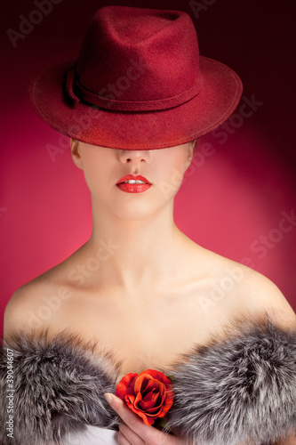 Photo: Portrait of stylish woman in hat with bright red lips Portrait of stylish woman in hat with bright red lips