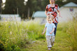 Adorable little girl in a meadow with grandmother