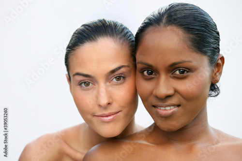 Photo: black and white woman posing together black and white woman posing together