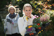 old and young women gardening