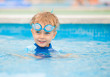 boy playing in a pool of water