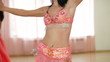 Woman perform belly dance at the school-dance