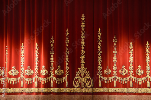 Photo: Red and gold stage theater curtain background Red and gold stage theater curtain background