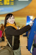 Girl doing self-checkin in the airport