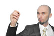 Businessman with pen in hand, writing on a white background