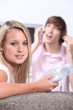 Teenagers choosing music on CD
