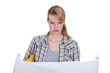 Woman looking at plans