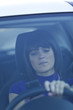 Woman driving holding a cellphone