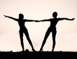 Silhouette of two young women