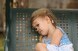sad little child on a bench