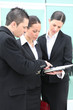 Photo: Three colleagues debating Three colleagues debating