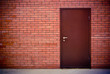 Red brick wall and the iron closed door Red brick wall and the iron closed door