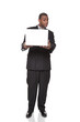 African American businessman looking warily at laptop computer