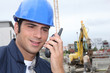Foreman communicating via radio