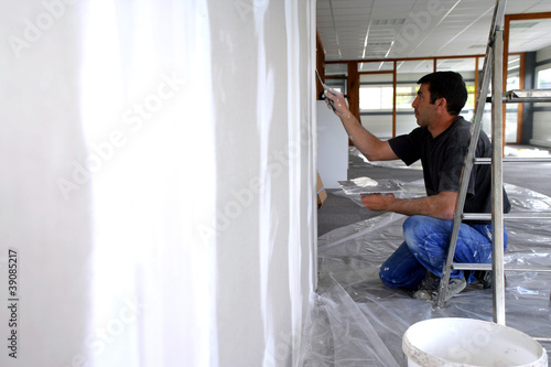 Photo: Man plastering a wall Man plastering a wall