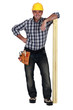 Portrait of a carpenter with timber