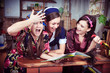 Portrait of three cheerful housewives