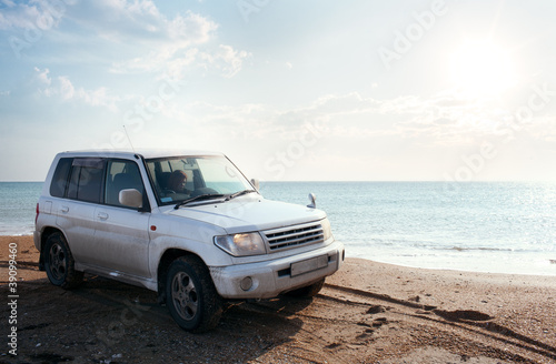 Photo: off-road vehicle on the beach off-road vehicle on the beach