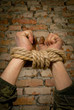 Hands tied up with rope