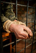 Photo: Hands of man tied up with rope Hands of man tied up with rope