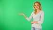 Beautiful blond girl presenting product on board