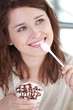 Young happy woman with cake