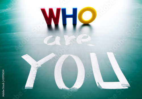 Photo: Who are you, concept words on blackboard. Who are you, concept words on blackboard.
