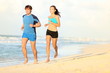 Couple running on beach