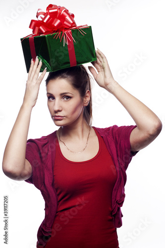 Photo: Pretty young woman with present on her head Pretty young woman with present on her head