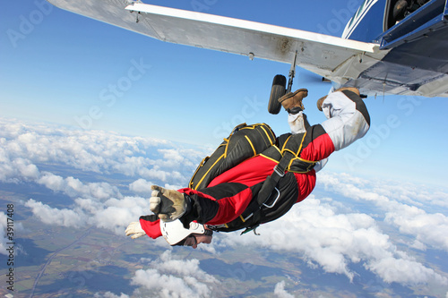 Photo: Skydiver jumps from an airplane Skydiver jumps from an airplane