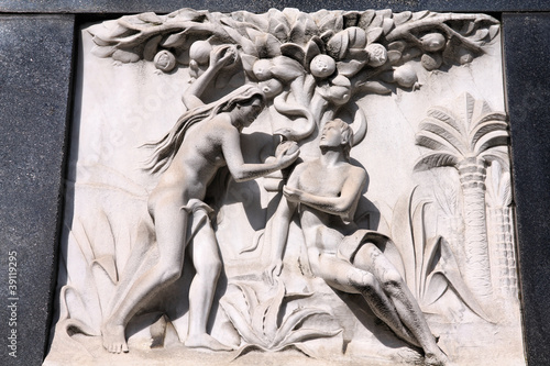 Photo: Adam and Eve - bas relief sculpture on a grave Adam and Eve - bas relief sculpture on a grave